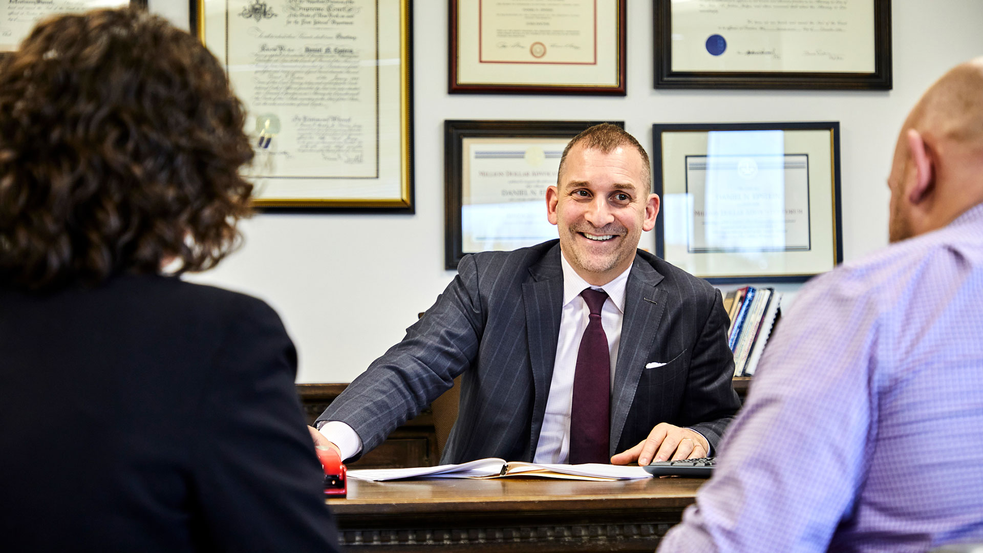 Daniel N. Epstein conferencing with his team