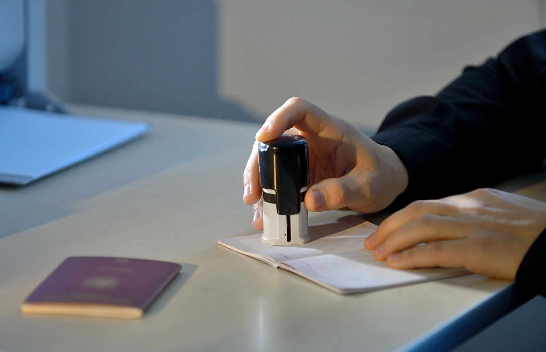 An immigration document being stamped