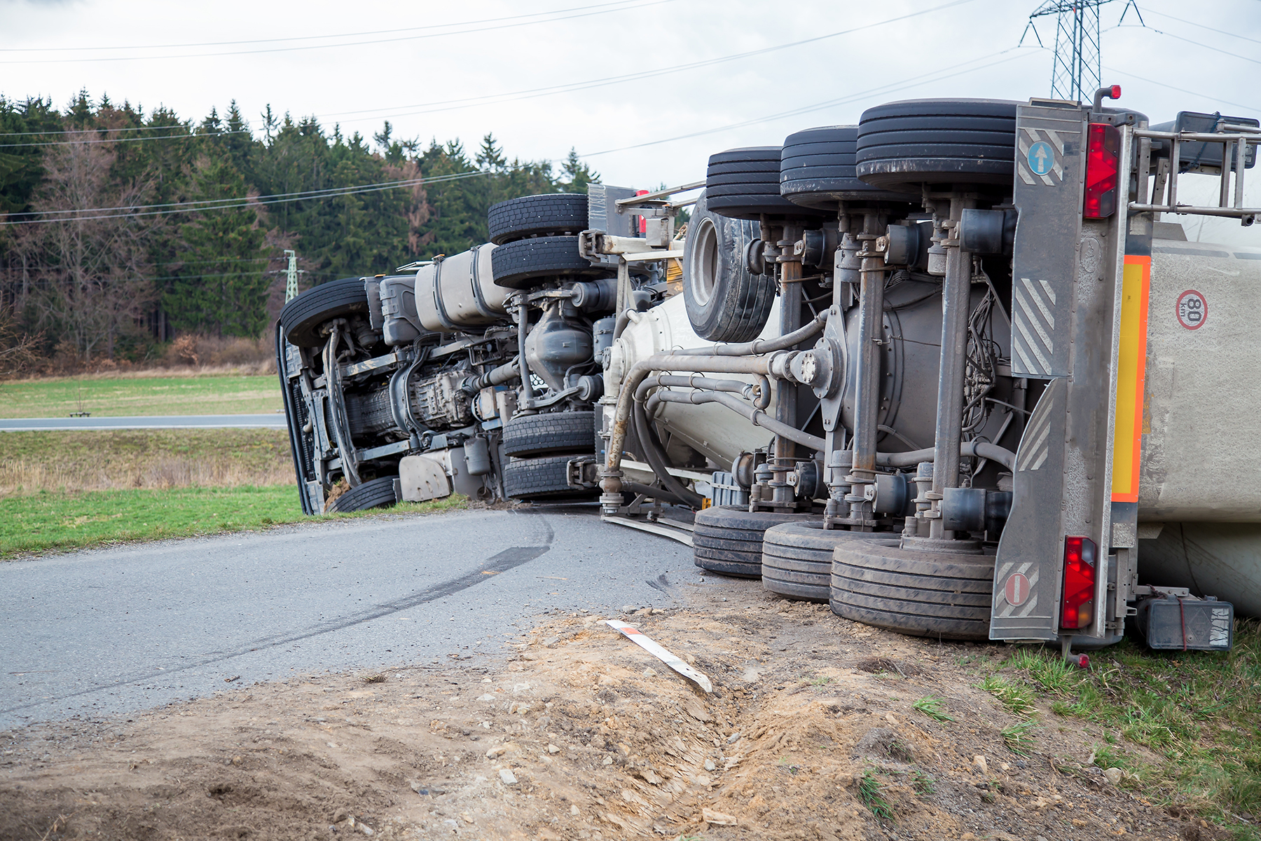 Truck accident. Truck lies on the road after incident.